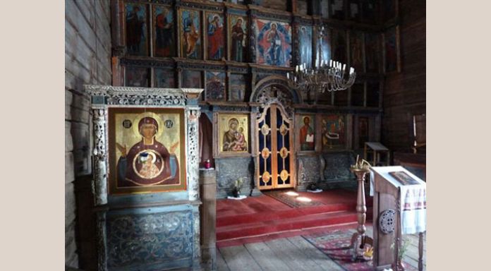 Interior of old wooden church on lake site Kondaponga