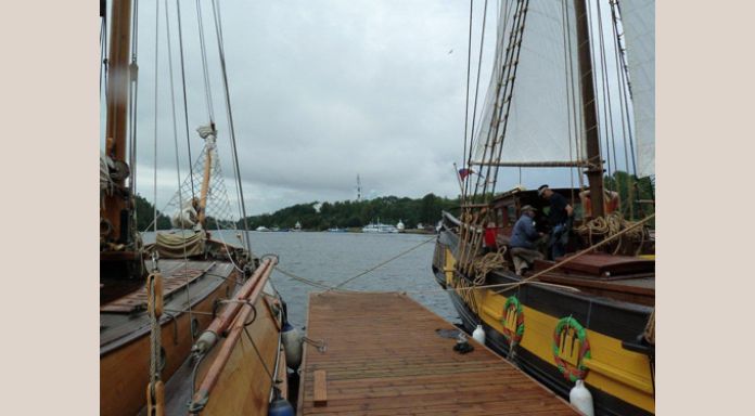 Moored aside "Star of Onega" with Valaam Monastery at distance